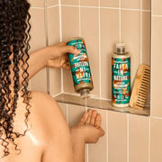 Faith In Nature Jojoba Smoothing Shampoo 400ml bottle lifestyle use image
