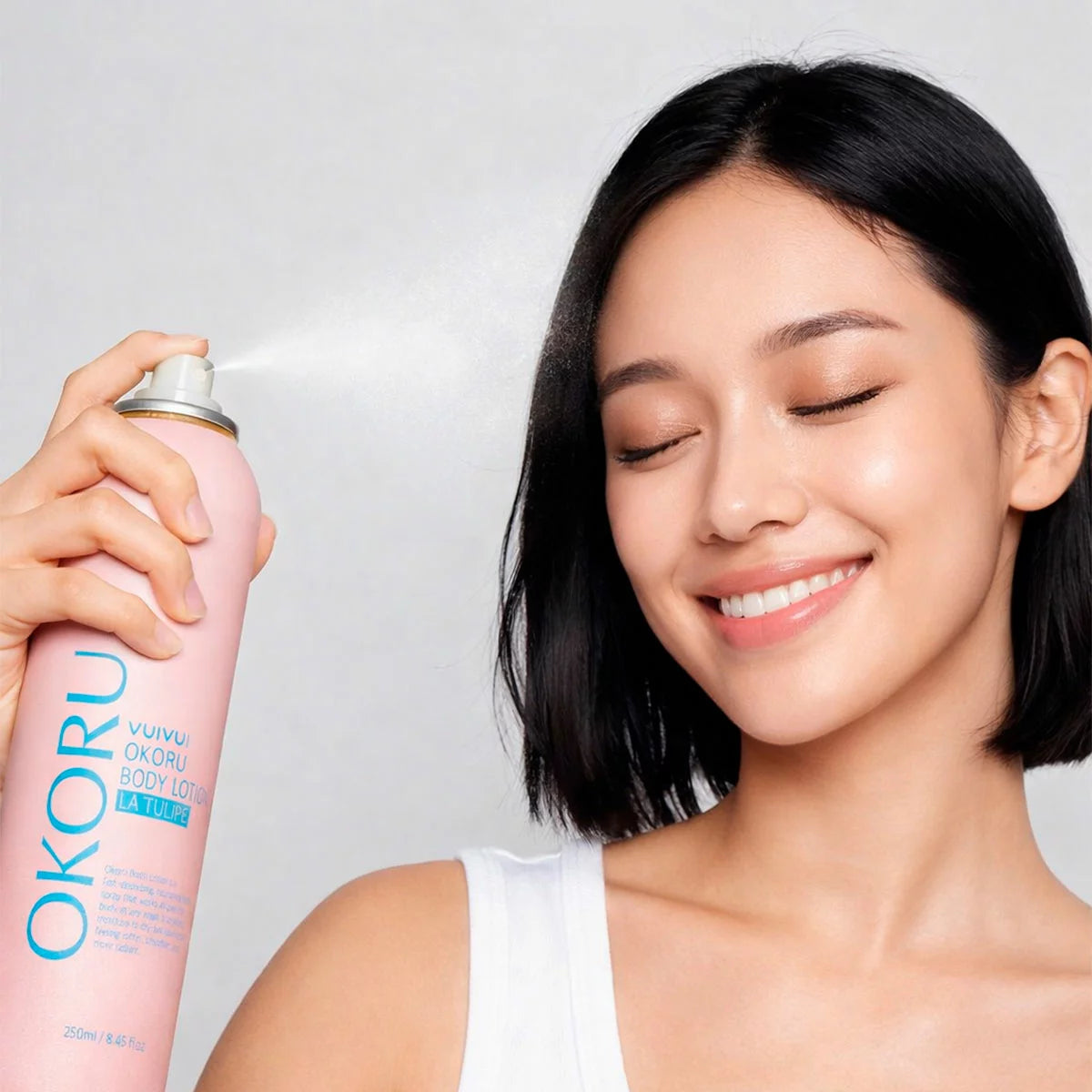 How to Use Image: Okoru body lotion spray La Tulipe 250ml applying mist on skin