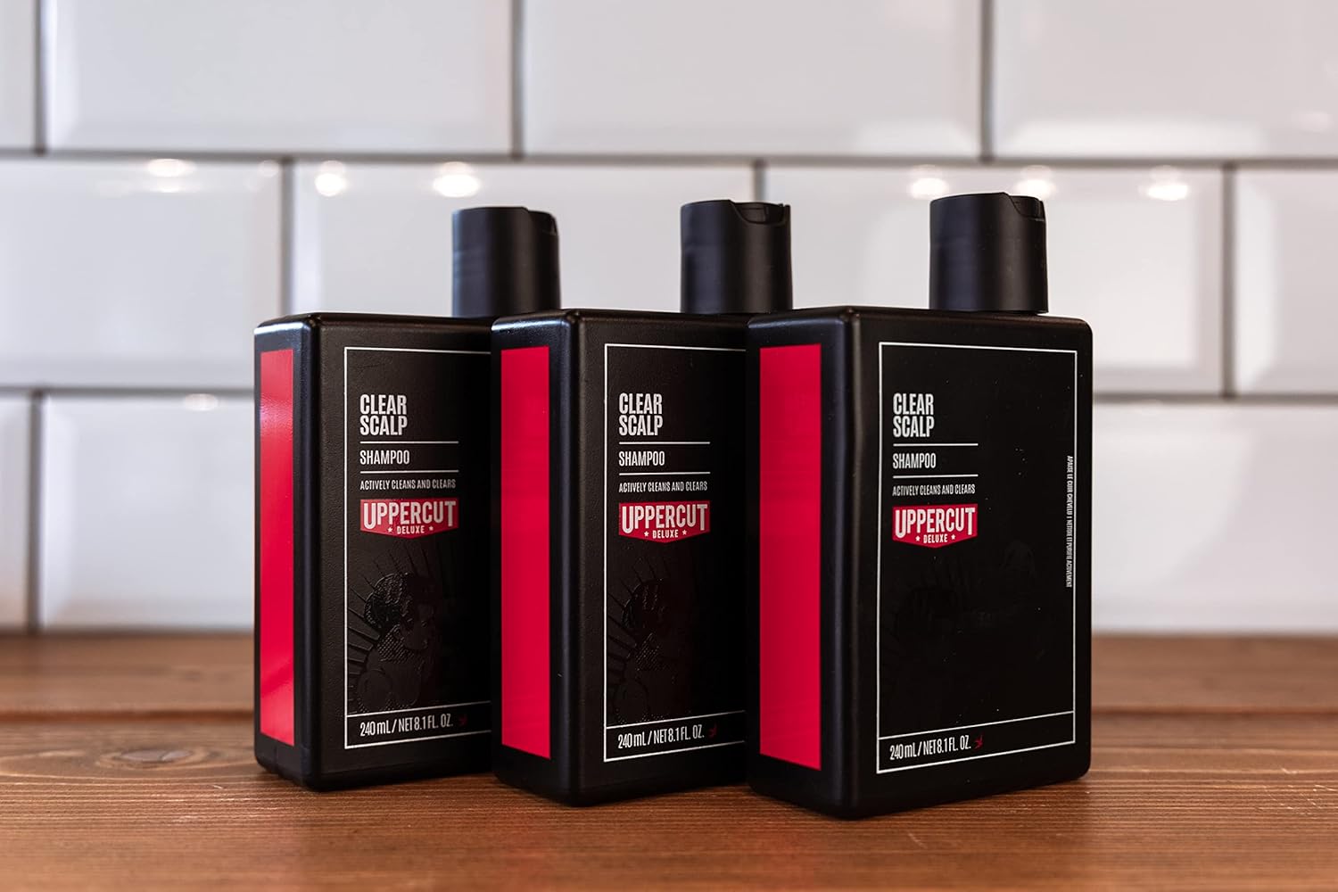 Lifestyle/use image: Uppercut Deluxe Clear Scalp Shampoo 3 240ml men hair care routine
