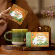 How to Use: Four Sigmatic Matcha Latte packet being mixed in a mug.
