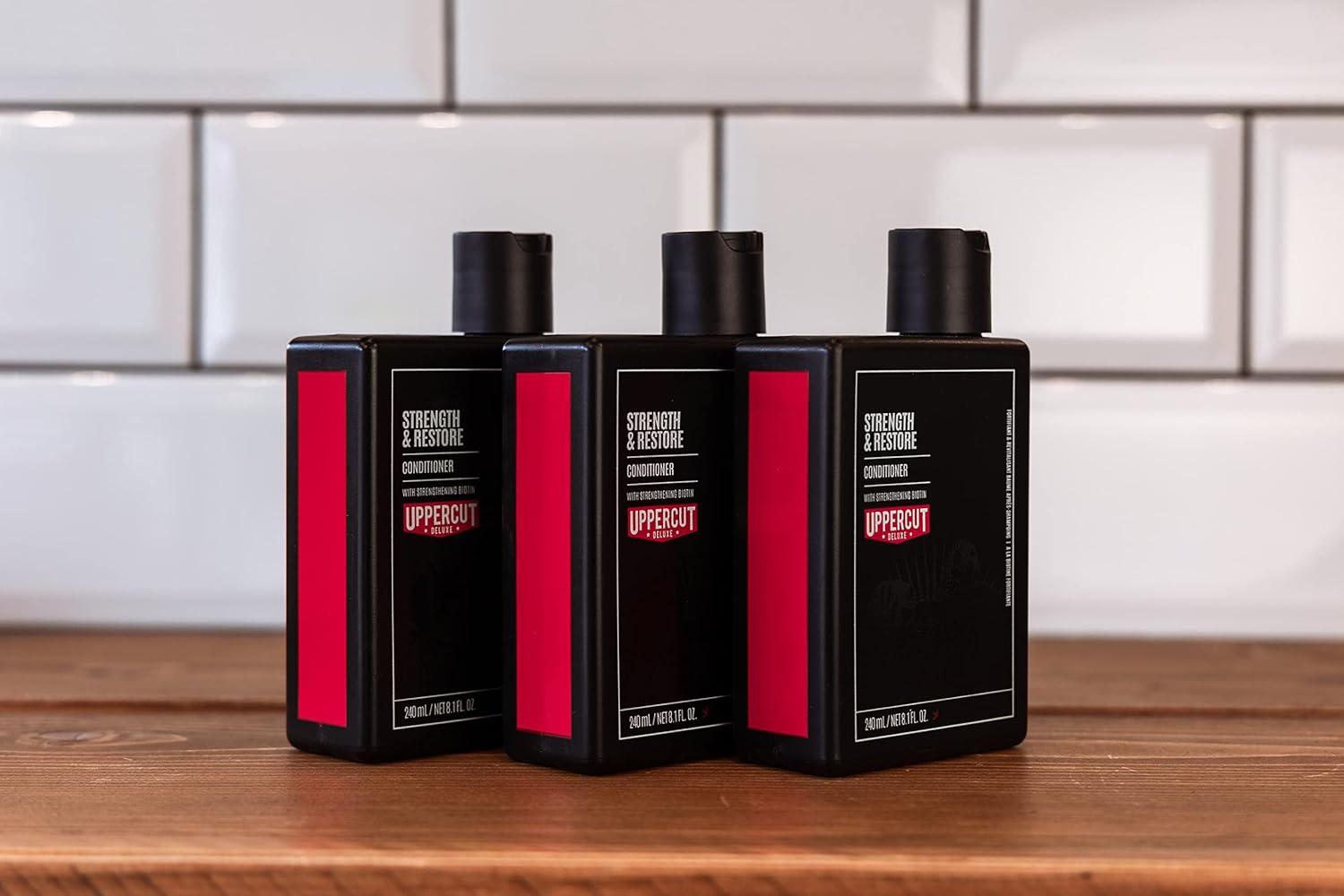 Lifestyle/use image: Uppercut Deluxe Strength and Restore Conditioner 3 240ml men hair care routine